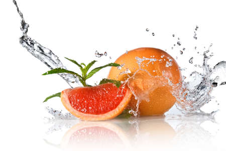 Water splash on grapefruit with mint isolated on whiteの写真素材