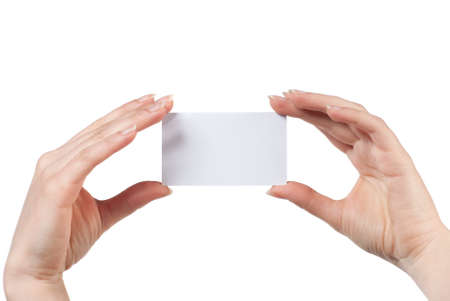 Woman hand holding empty visiting card isolated on whiteの写真素材