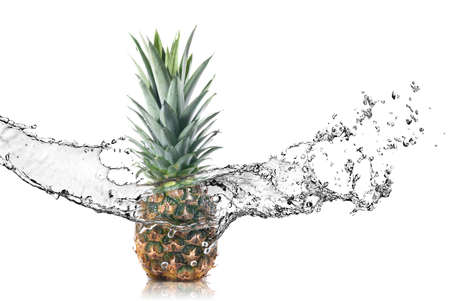 pineapple with water splash isolated on whiteの写真素材