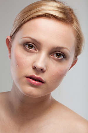 Portrait of sad crying woman の写真素材