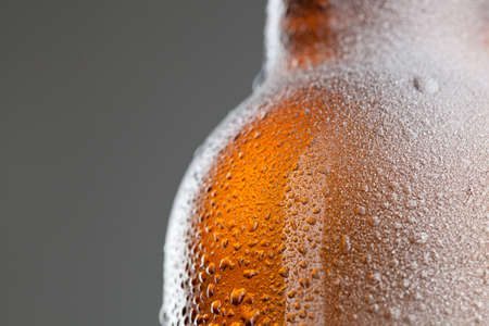 Beer bottle with water drops and frostの写真素材