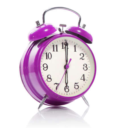 pink old style alarm clock isolated on white pink old style alarm clock isolated on white