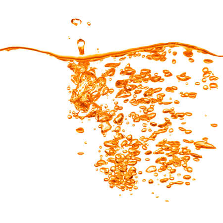 orange water splash isolated on whiteの写真素材