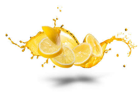 Falling slices of lemon with juice splash isolated on whiteの写真素材
