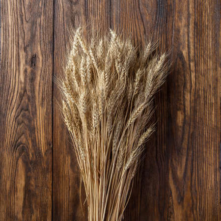 wheat on wooden background. top viewの写真素材
