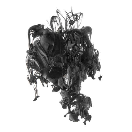 Splash of black ink in dropped into the water isolated on whiteの写真素材