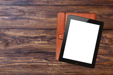 tablet pc with blank screen on wooden backgroundの写真素材