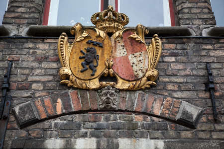 Decoration on old houses of Bruges in Belgiumの写真素材