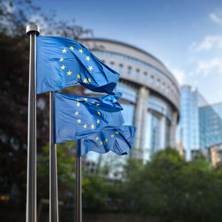 European union flag against parliament in Brussels, Belgium