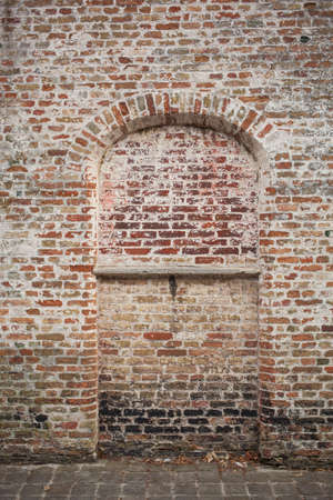 old brick wall with bay windowの写真素材