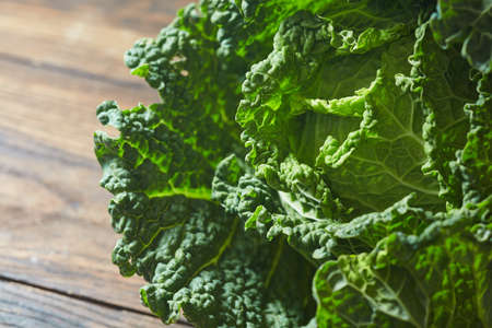 Savoy cabbage super food close up in wooden backgroundの写真素材