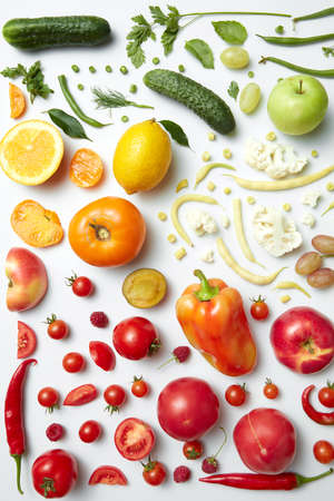 Rainbow collection of fruits and vegetables on white backdrop, weight loss, food for vegans and healthy diet.の写真素材