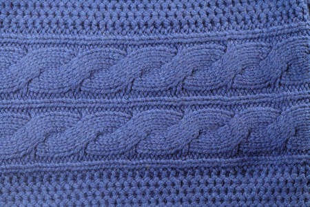 Blue knitted sweater texture background. Space for cop