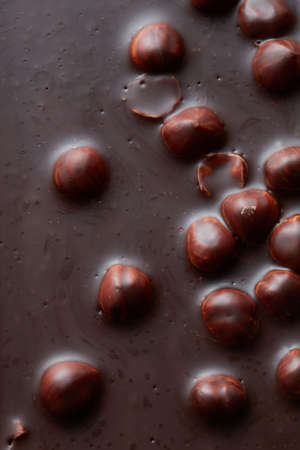 texture of chocolate with nuts macro. Food background