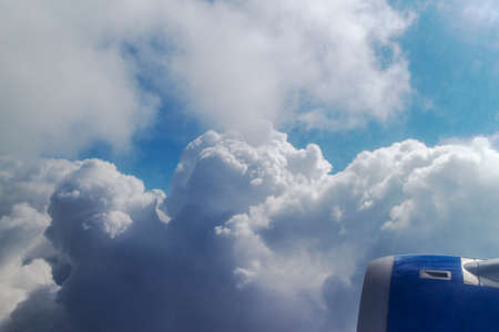 airplanes wing over a blue and cloudy sky