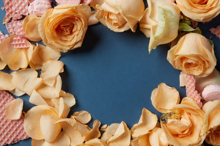 Waffles and roses as decoration of background