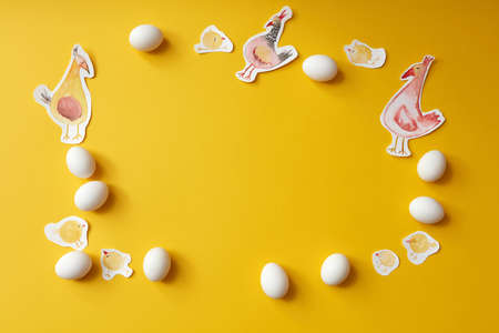frame of eggs and painted chickensの写真素材