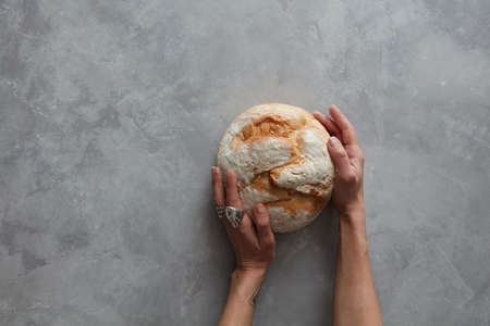 man holding tasty fresh bread,