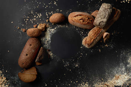 Different kinds of bread on background