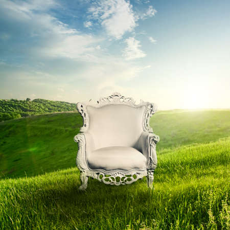 Arm chair and landscape on sunsetの写真素材