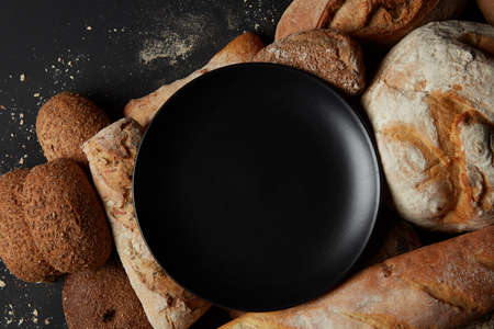 Different kinds of bread on backgroundの写真素材