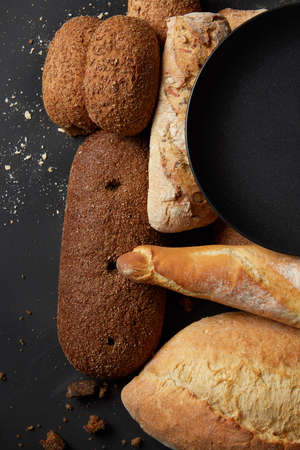 Different kinds of bread on backgroundの写真素材