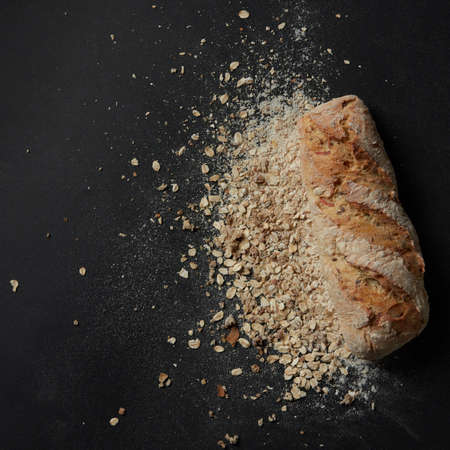 Loaf of bread with sprinkled flourの写真素材