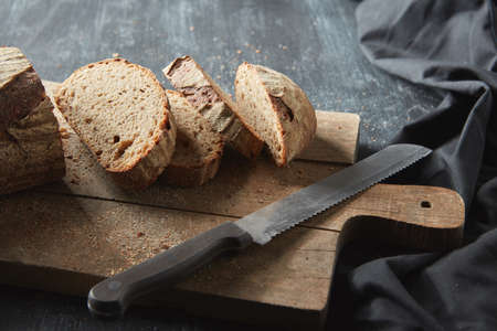 Sliced bread on wooden boardの写真素材