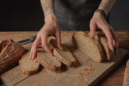 Baker Holds Bran Breadの写真素材