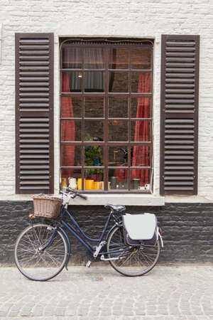 Retro bicycle standing near the old window, Belgiumの写真素材