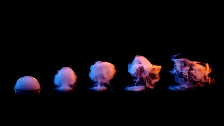 set of colored smokes on black backgroundの写真素材