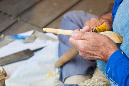 the artisan makes a spoon of woodの写真素材