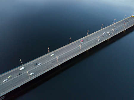 Aerial view of North Bridge with cars and Dnipro river from above, city of Kyiv city, Ukraine
