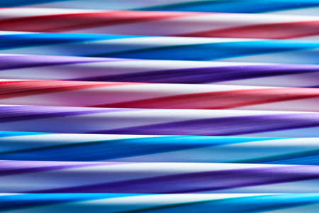Abstract background from many multi-color straws.