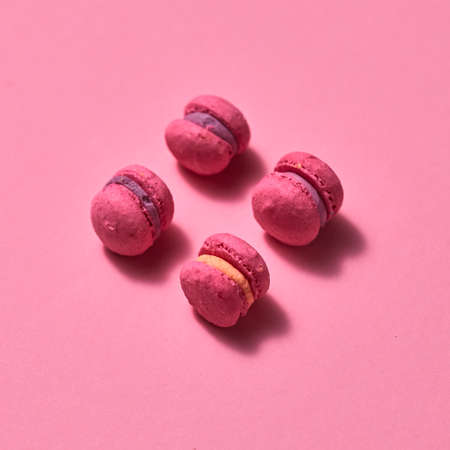 pink macaroons on pink background, homemade food