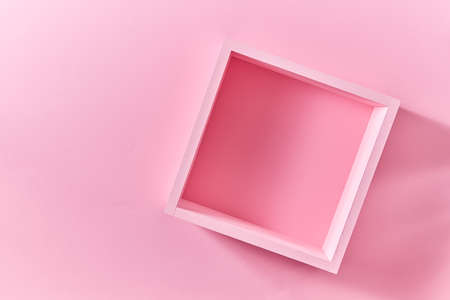 empty pink wood shelf on pink wall with copy space