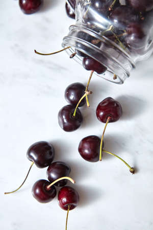 Fresh natural organic cherries on white background for making delicious natural jam. Top view.