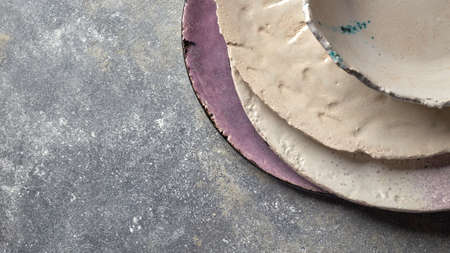 Top view of porcelain dishes on a gray background with space under text. Traditional decorative...
