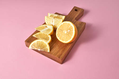 Juicy yellow slices of ripe lemon - ingredients for preparind natural detox beverage for diet....