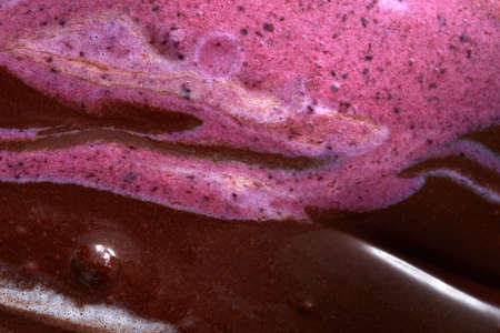 Creative geometric background with melting colorful sorbet in a pink and brown tones. Summer food concept. Top view.の写真素材