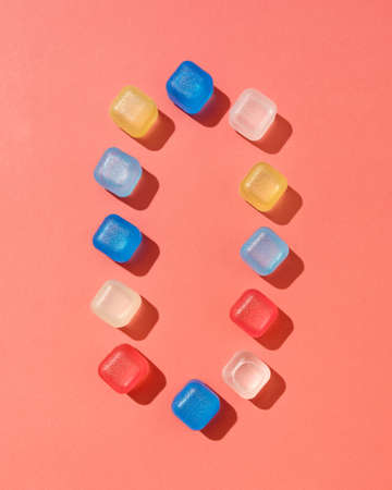 Figure zero from colored plastic ice cubes with shadows on a background in a color of the year 2019...