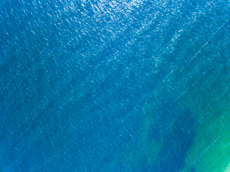 Aerial photography from the drone sea blue surface. Natural summer backgroundの写真素材