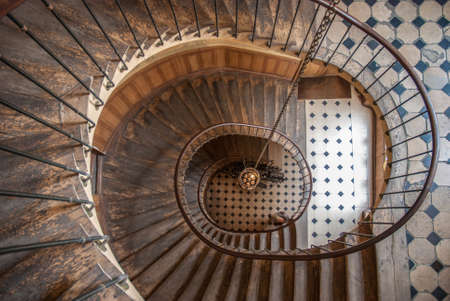 Paris, France - August 05, 2006: Beautiful vintage high spiral staircase in the gallery of Vivienne....