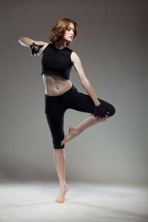 attractive young woman dancingの写真素材