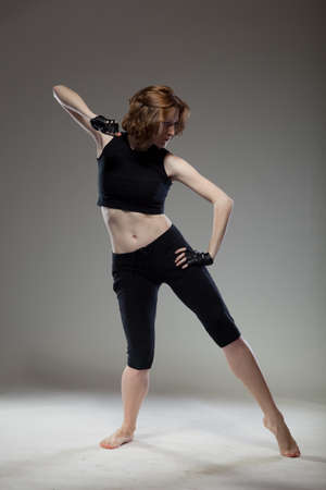 attractive young woman dancingの写真素材