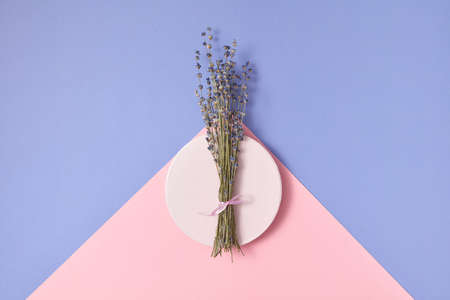 Branch of lavender on a round plate.