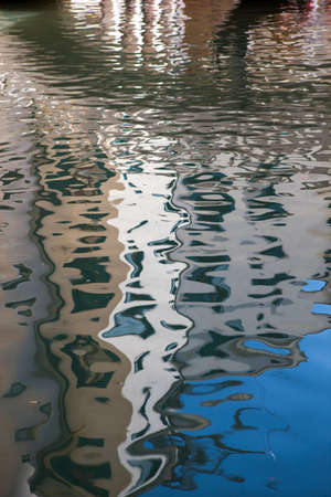 Abstract reflection of old buildings in the water.の写真素材