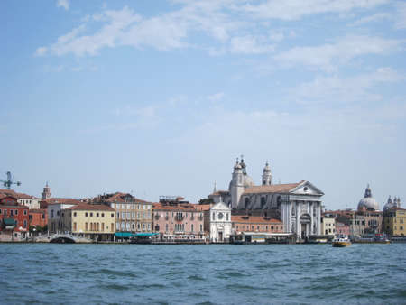 Old historical buildings and churches - view from water.の写真素材