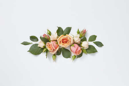Flowers greeting card from roses and green leaves.の写真素材