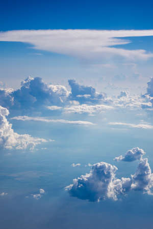 Clear blue sky with big fluffy cumulus clouds.の写真素材